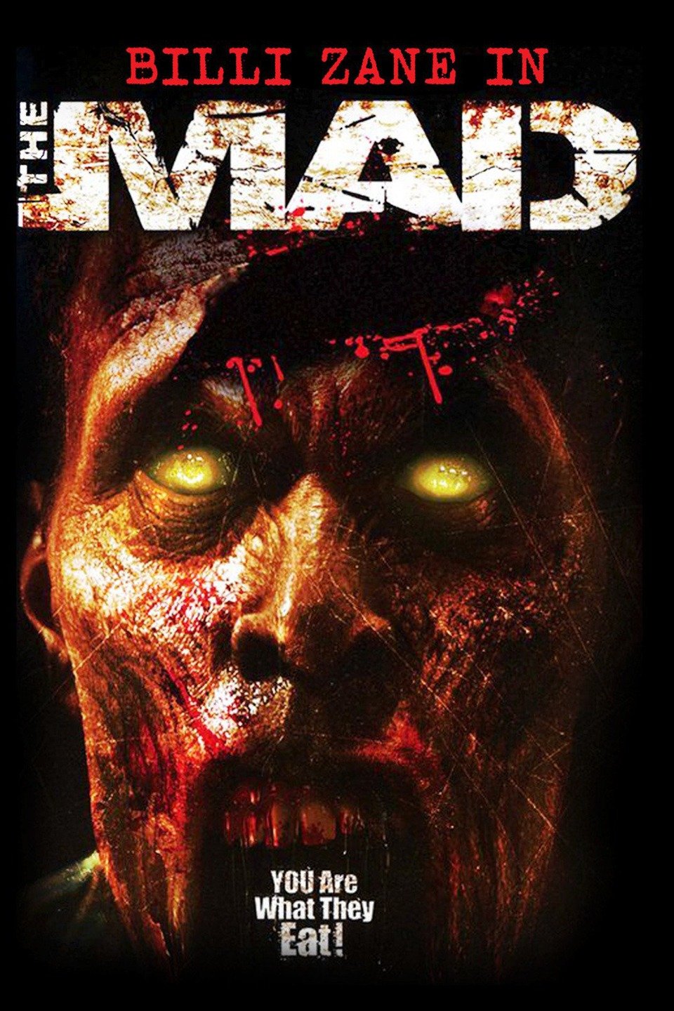 The Mad movie poster with a pupil-less, yellow-eyed zombie covered in blood.