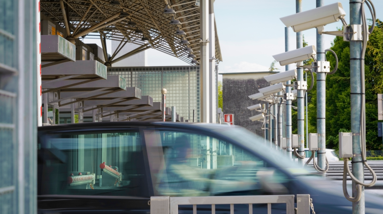 car driving through toll zone