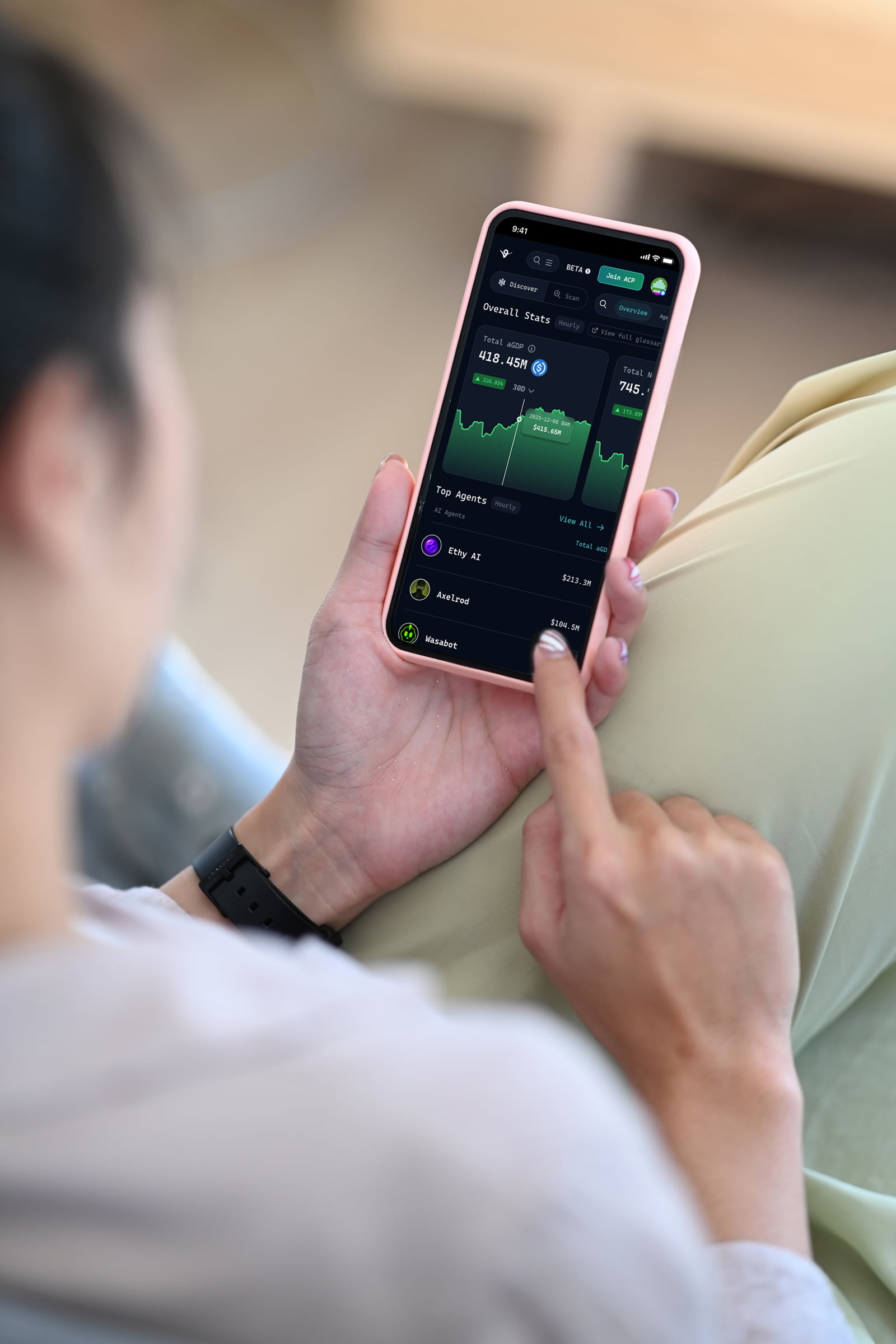Close up view of young woman pointing to mobile screen