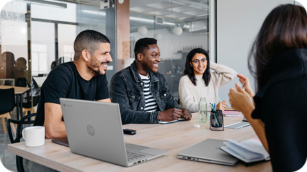 people gathered around computer