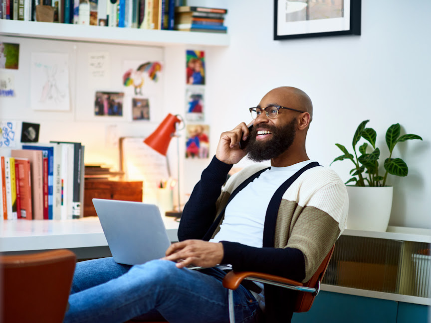Man sitting on chair on cell phone