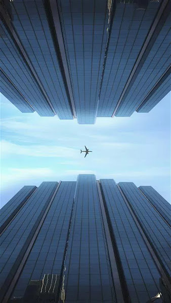 An airplane between two buildings