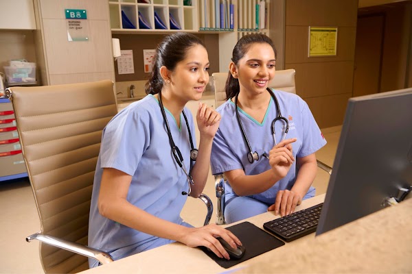 Two nurses looking at the monitor