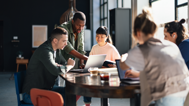team working together at a table in an office