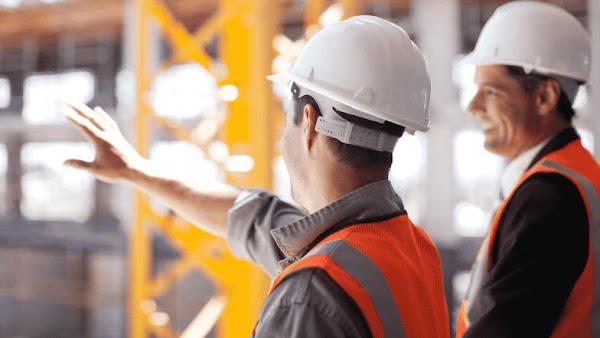 construction leaders reviewing a project site