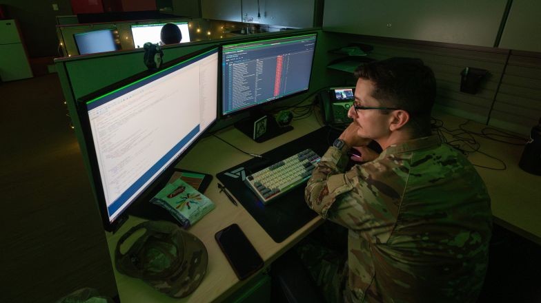 Service person reviewing multiple screens of information