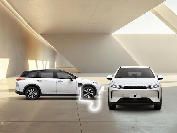 Two white n7 LUXGEN cars