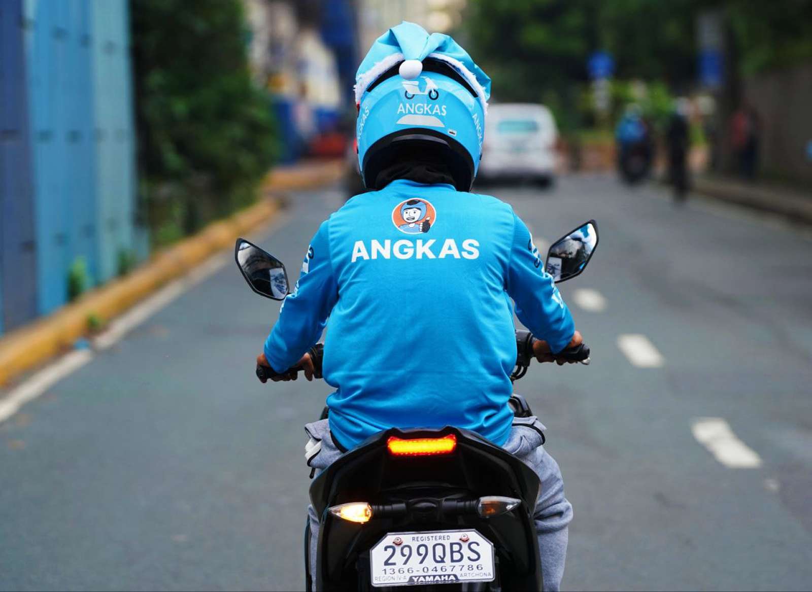An Angkas driver riding a bike
