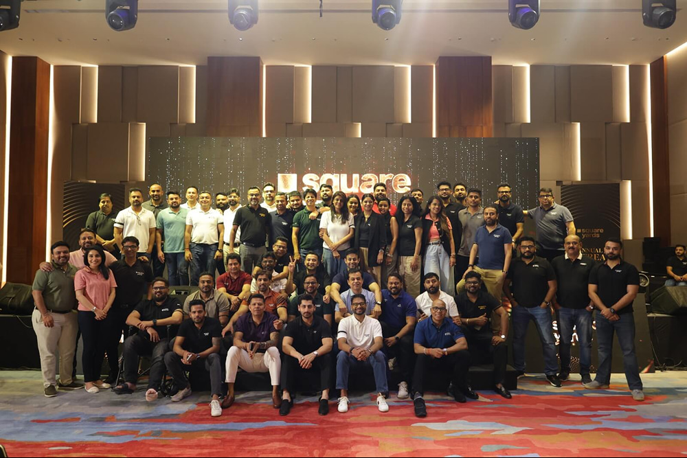 Square Yards team at an indoor corporate event
