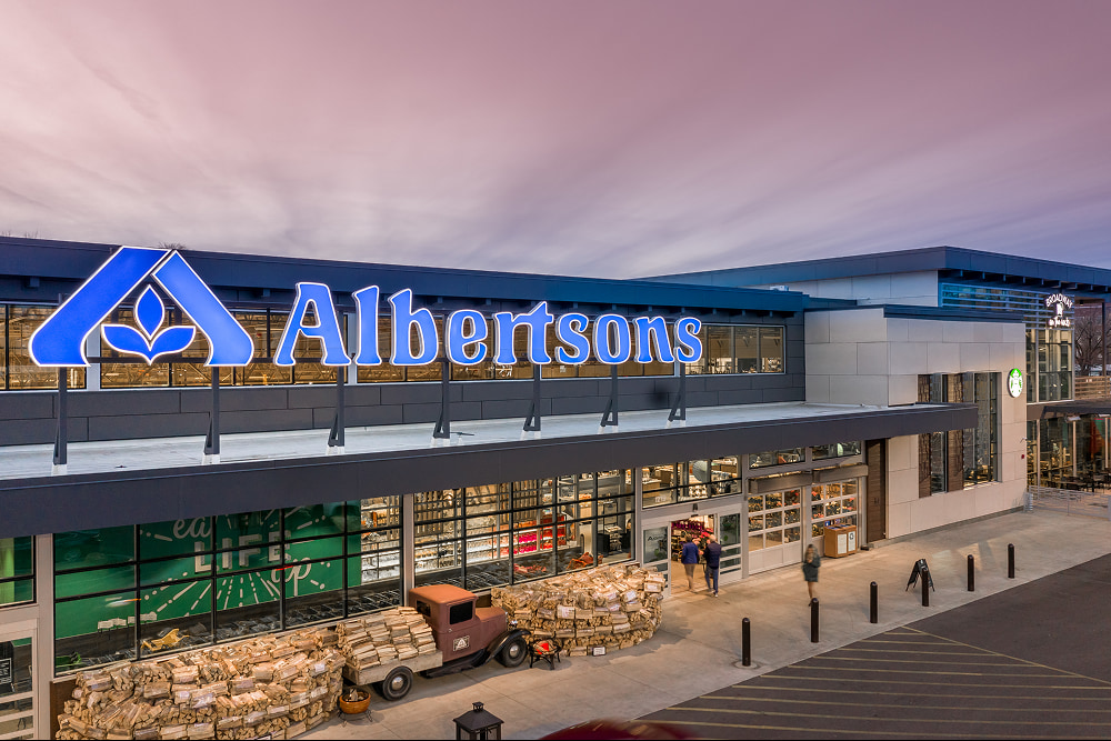 Albertsons huge store with a truck and materials lined outside