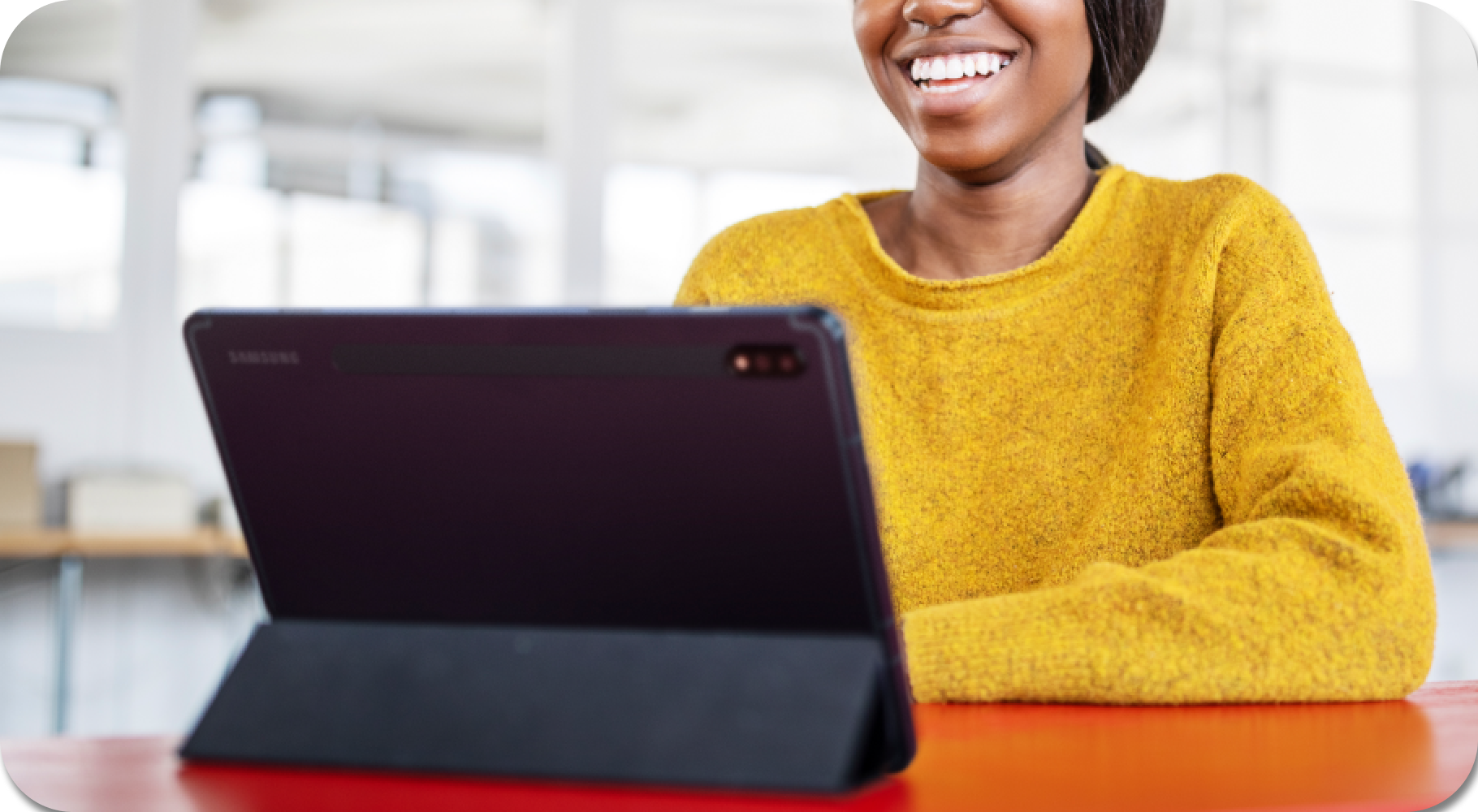 Woman smiling at laptop