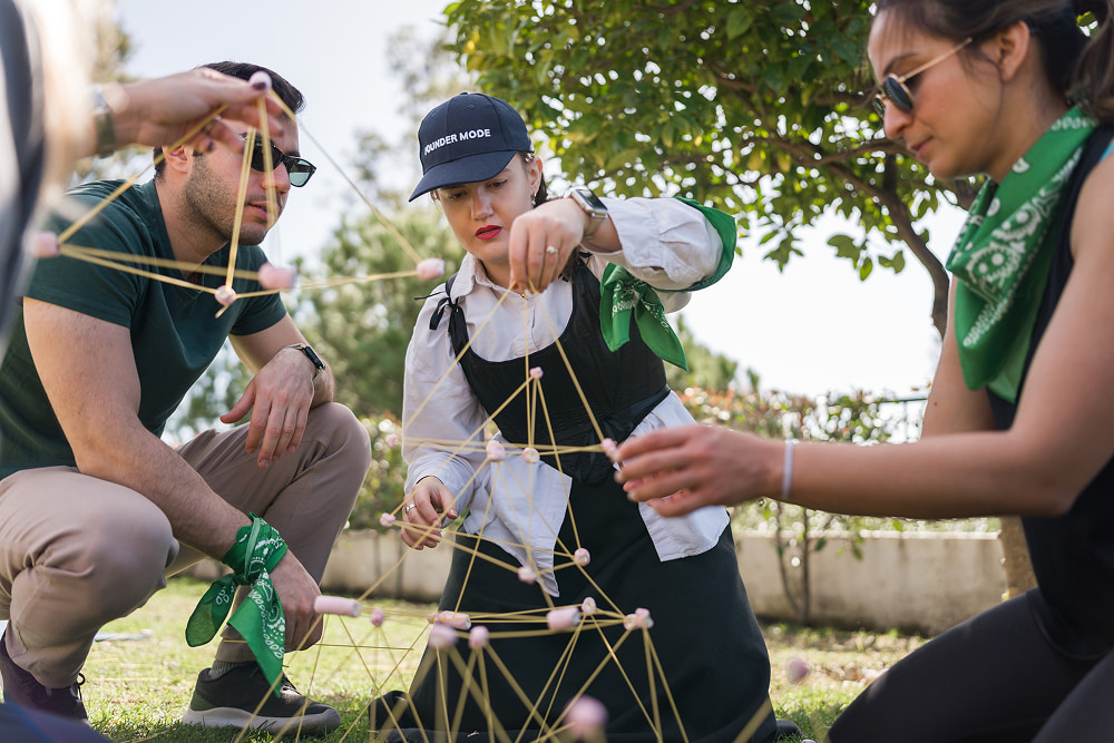A group of people participating in an outdoor team-building activity