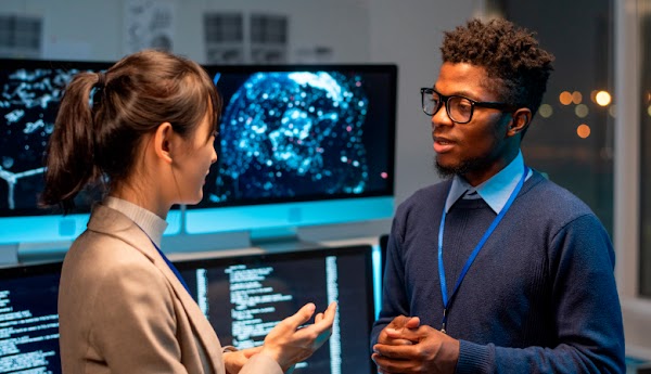 Generic stock photo of two people talking.