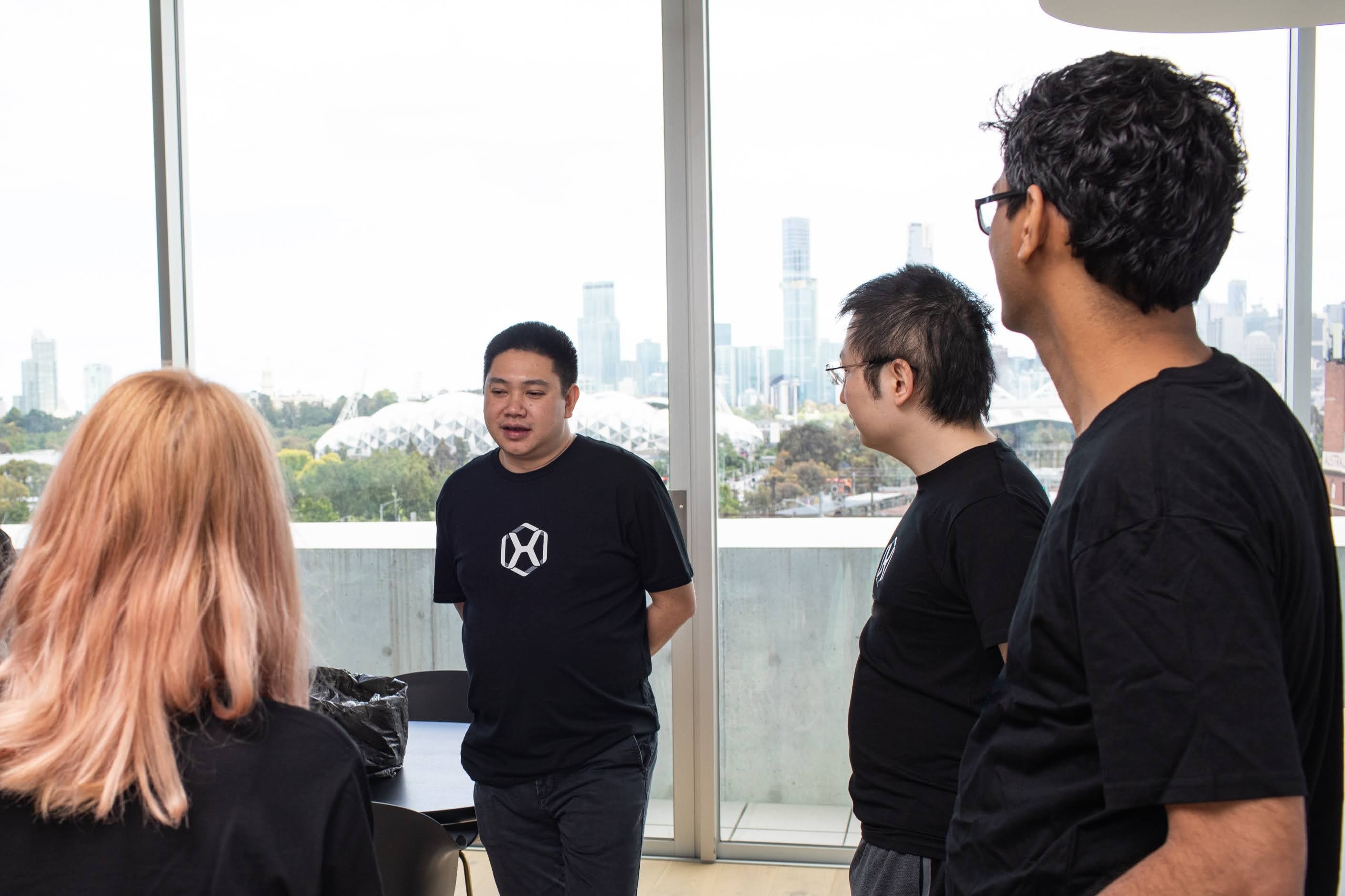 A group of individuals in an office setting