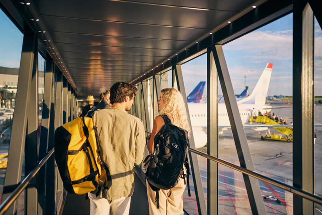 A man and woman about to board a flight