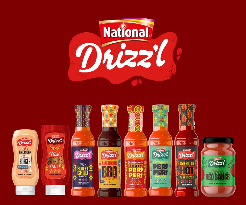 National Drizz'l sauce bottles lined up, including American Classic Burger, Thai Sriracha, BBQ, Peri Peri, and Red Sauce