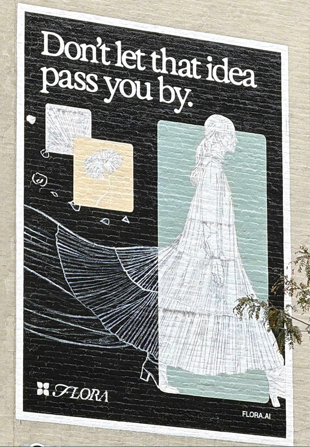 A black mural with white text reading "Don't let that idea pass you by." and a stylized drawing of a figure in a long dress