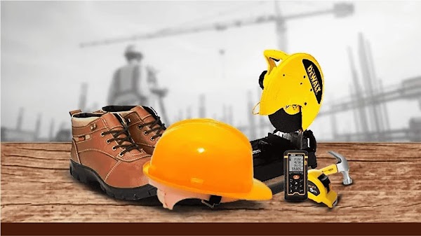 Shoes, helmet and manufacturing site tools against a construction site backdrop