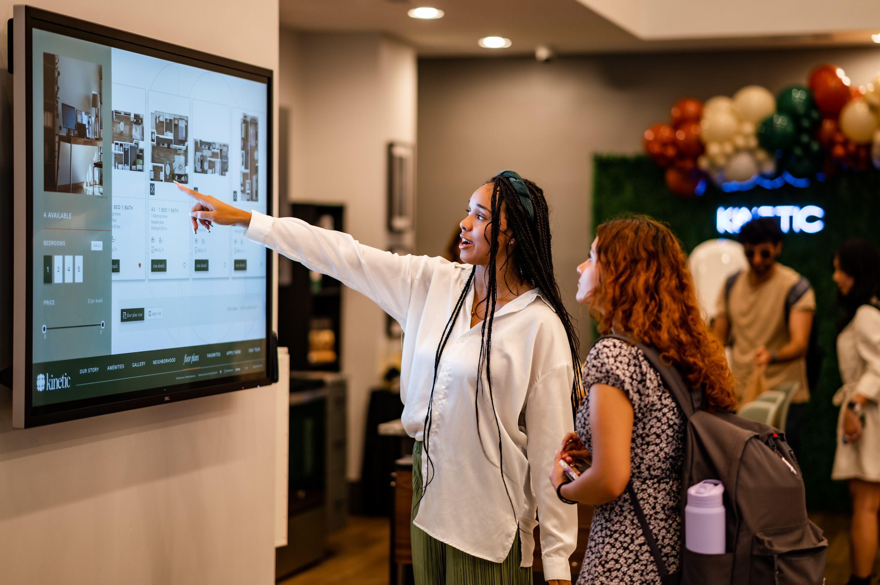 Two students looking at a screen