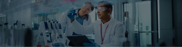 A man and a woman experimenting in a lab