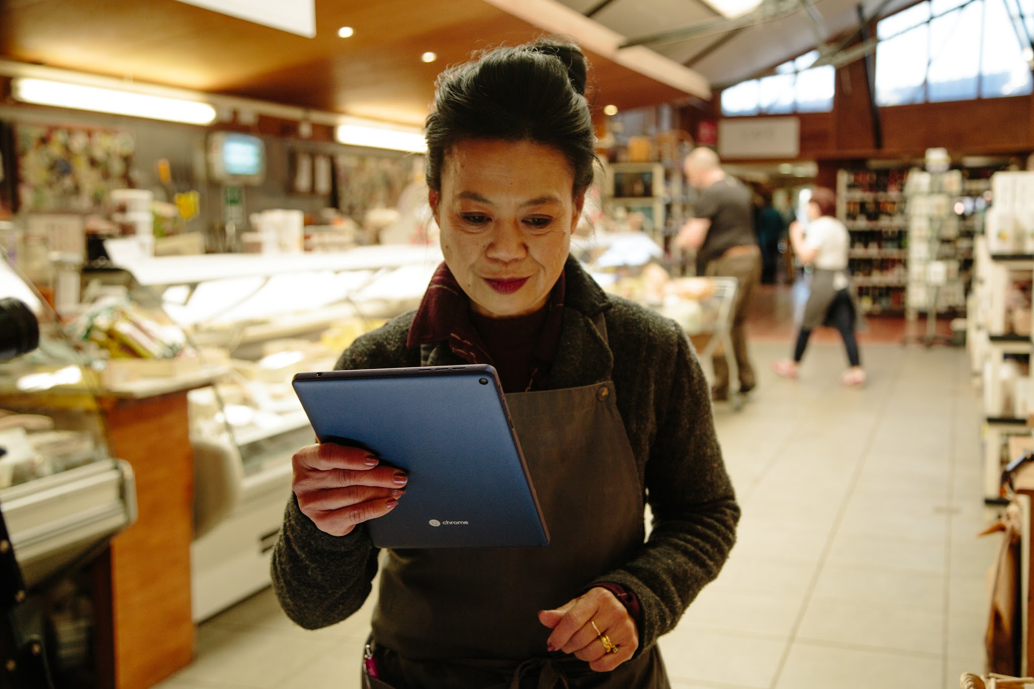 Woman holding tablet in store