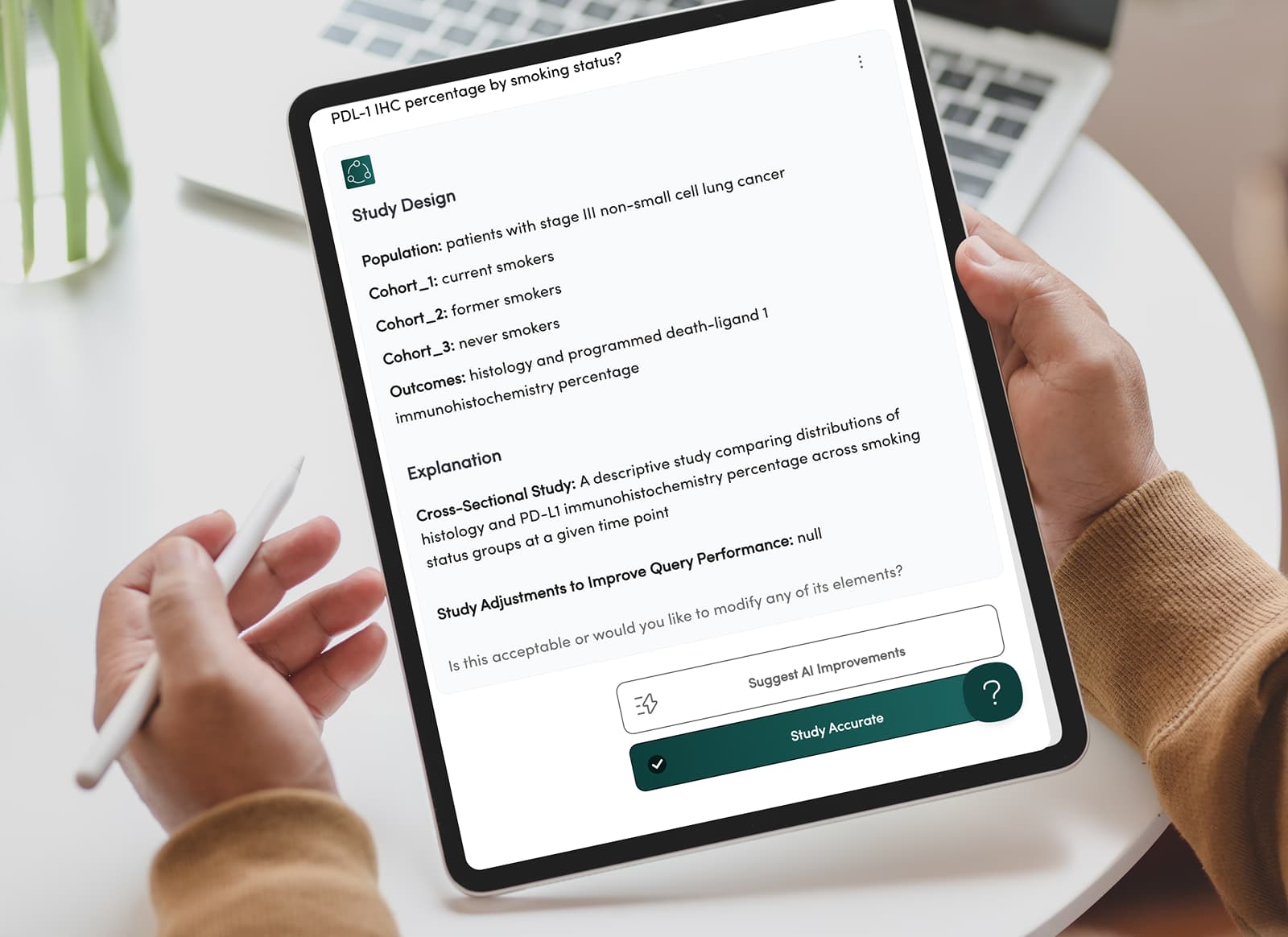 A hand holding a tablet