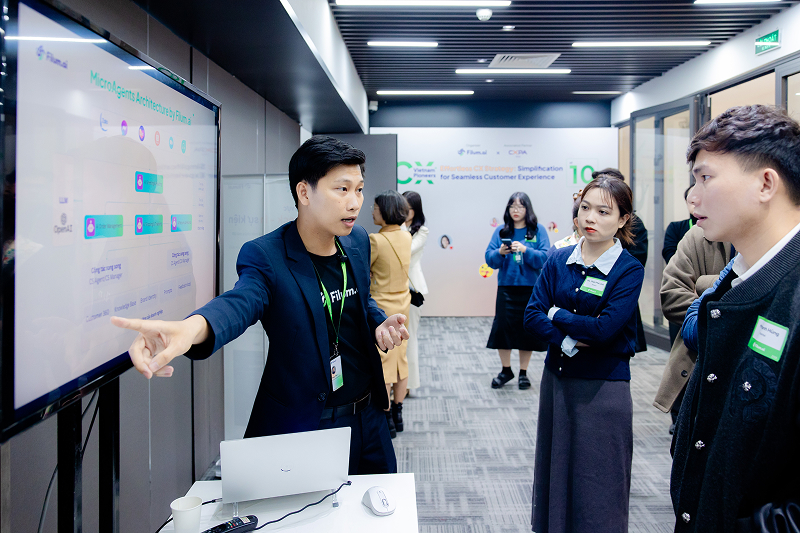 Filum team looking at a workflow on an LCD screen