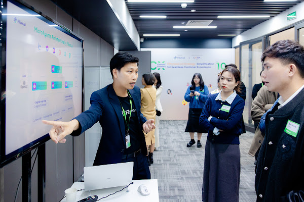 Filum team looking at a workflow on an LCD screen