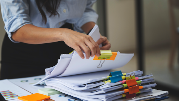 woman sorting through files