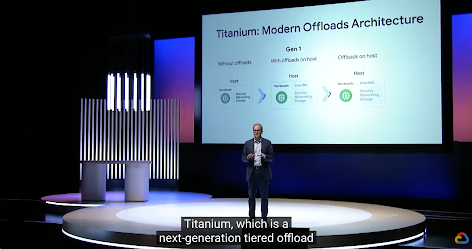 man on stage with screen behind