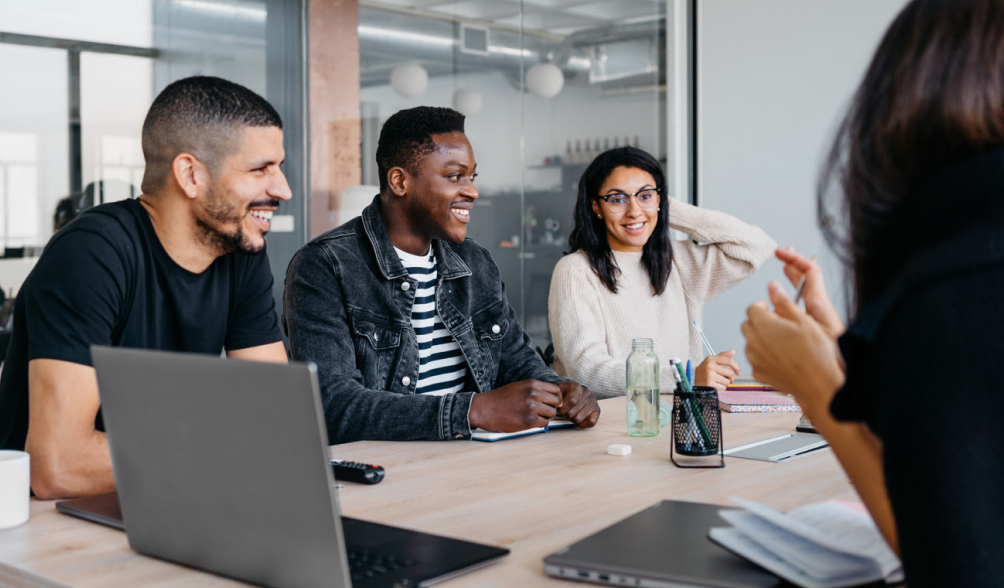 People are engaged in a discussion at the table