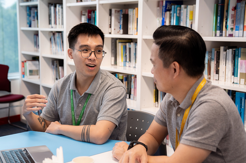 Two men in discussion