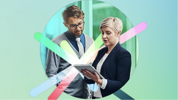 two people looking at a tablet