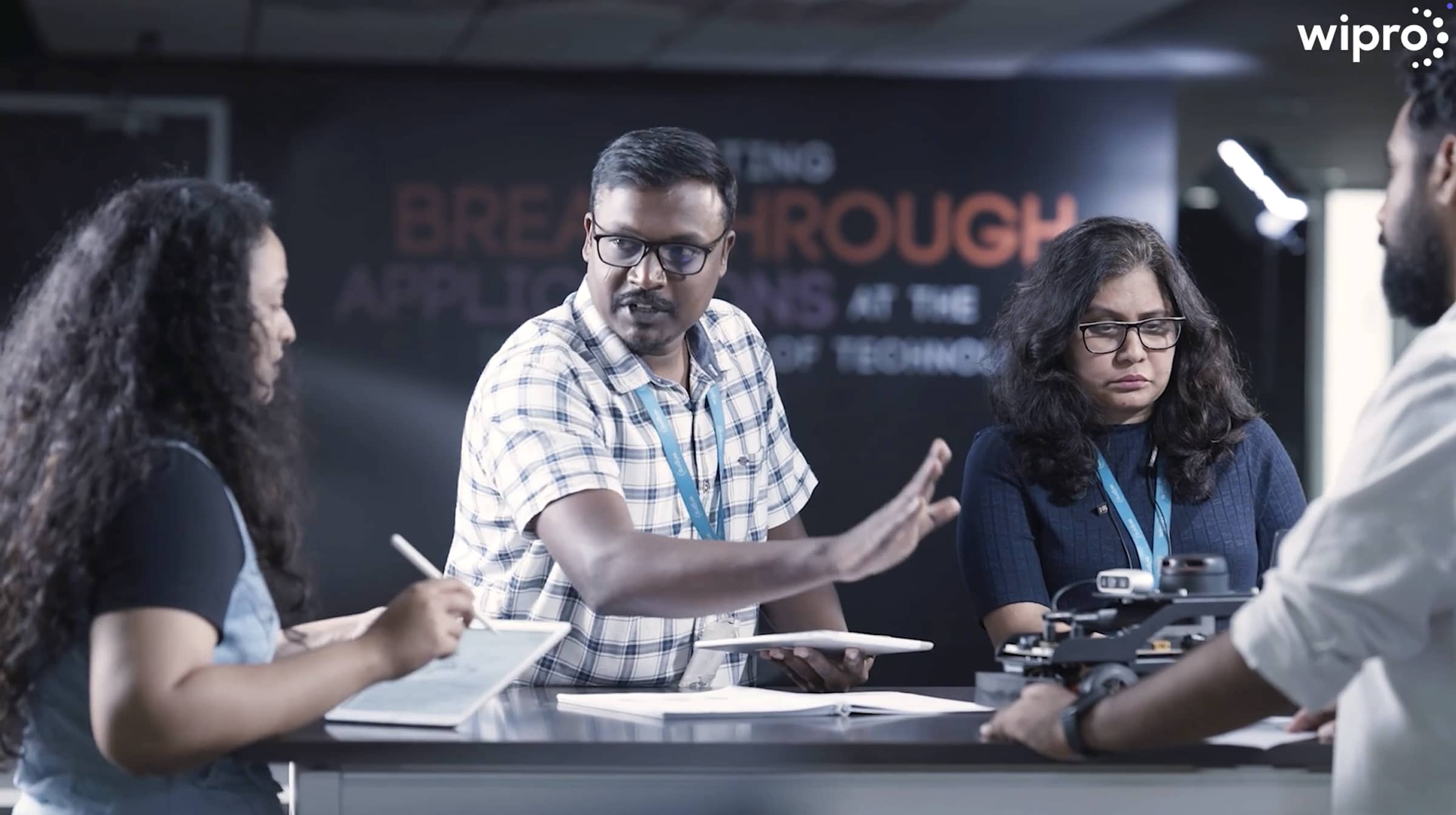 Four individuals in a discussion