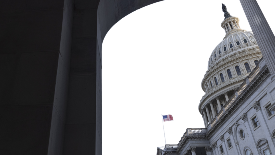 The U.S. Capitol building viewed through an archway