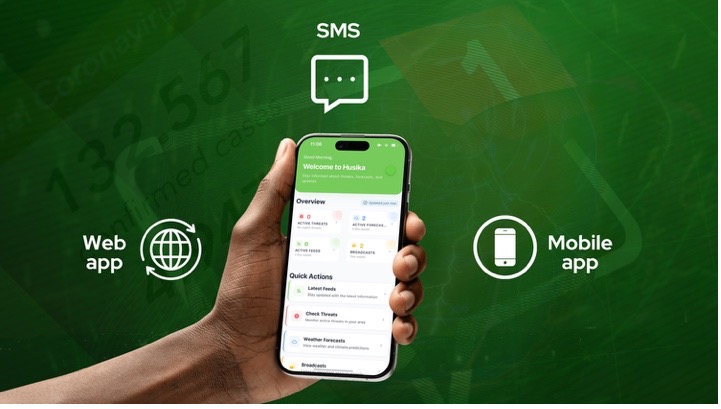 A smartphone is shown in the center of the image displaying the Husika app interface