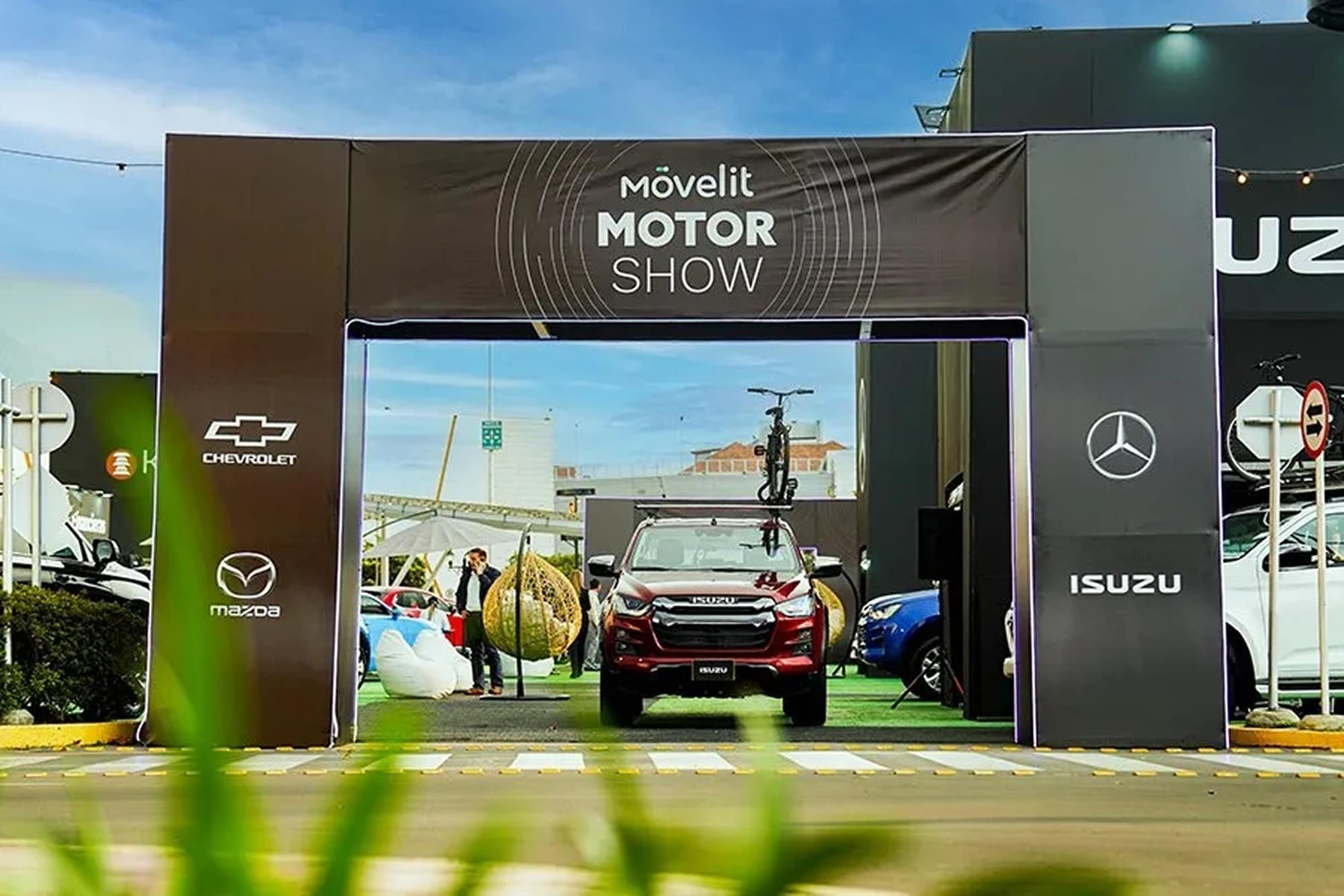 Movelit Motor Show entrance arch with a red Isuzu truck.