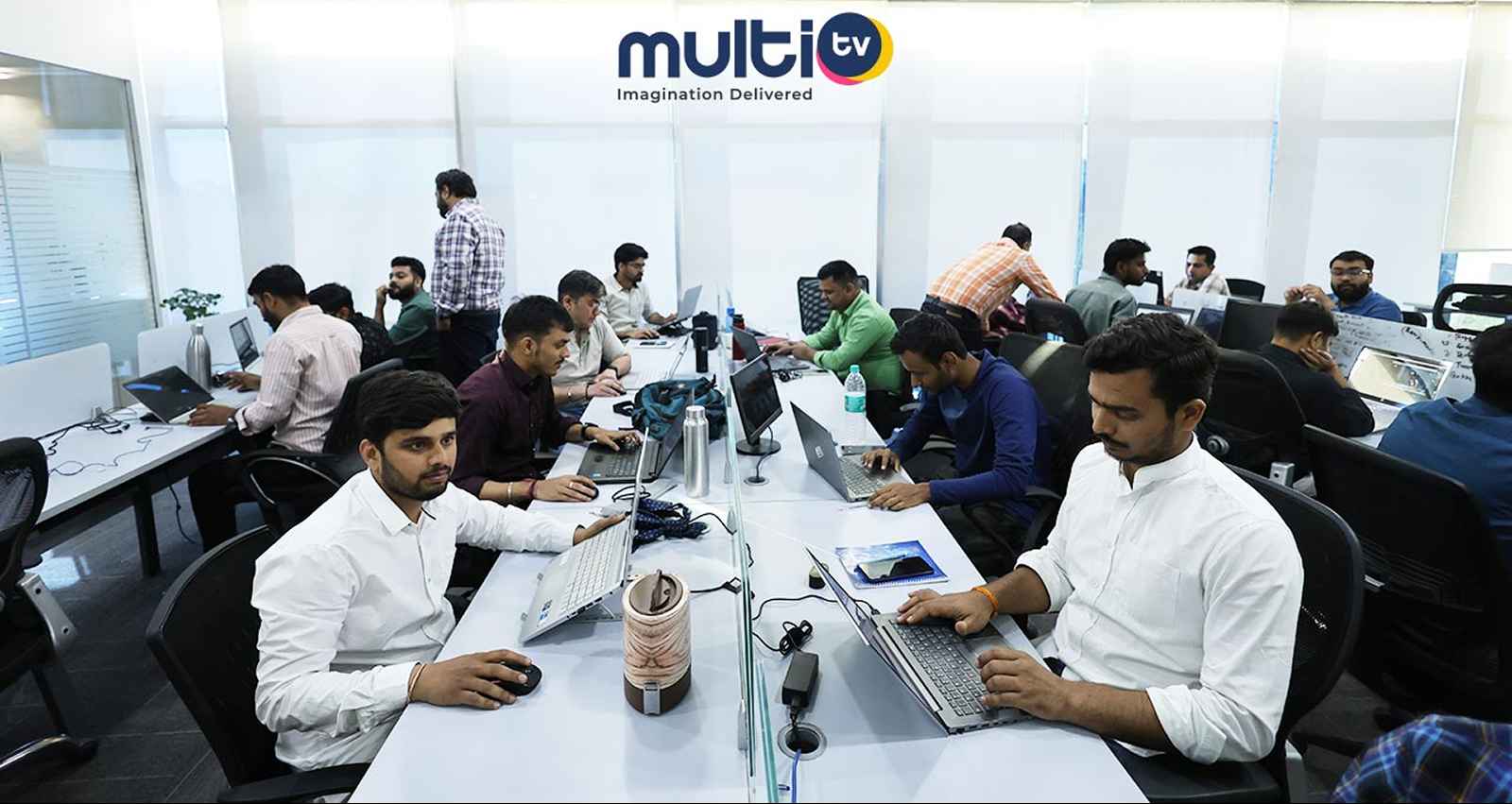 MultiTV team working in office