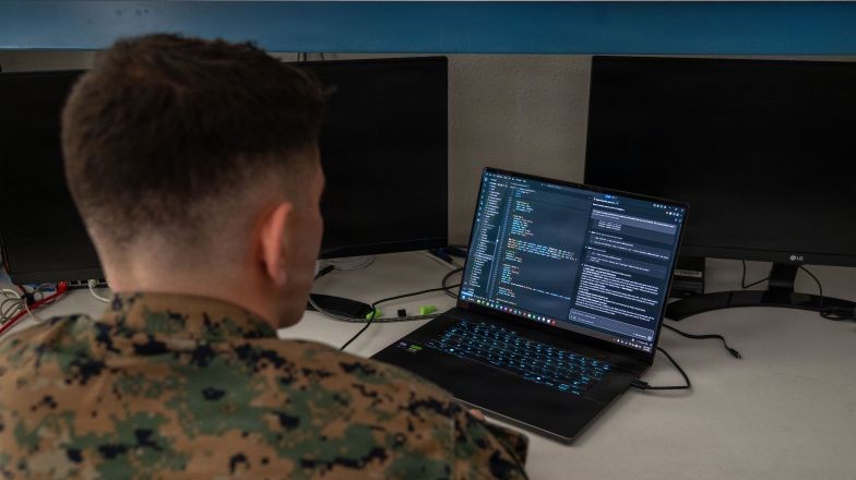 Person reviewing code on laptop