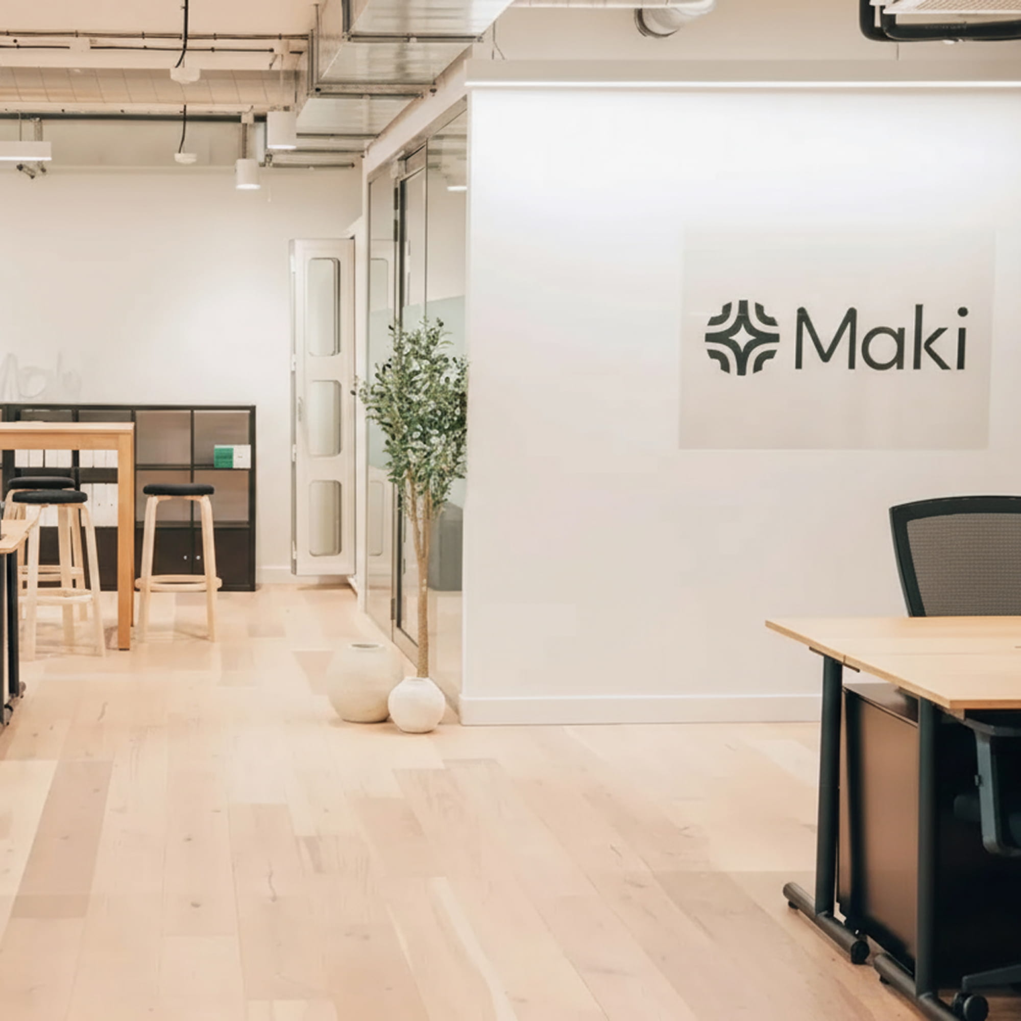 Office interior with Maki signage in the background