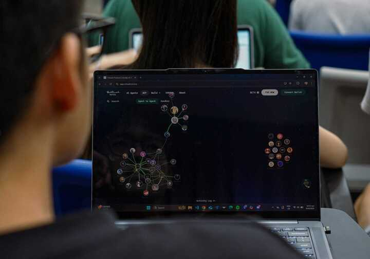 Student looking at the laptop