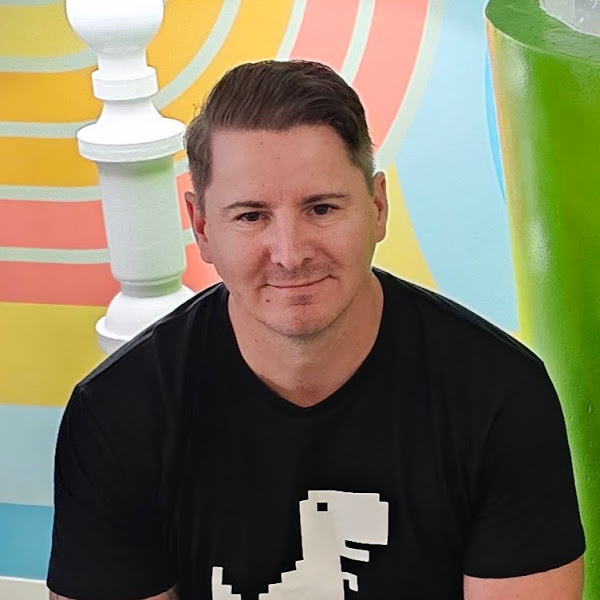 Adult man in black t-shirt and a multicolor background