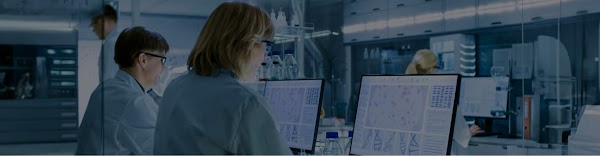 A man and woman working on computers