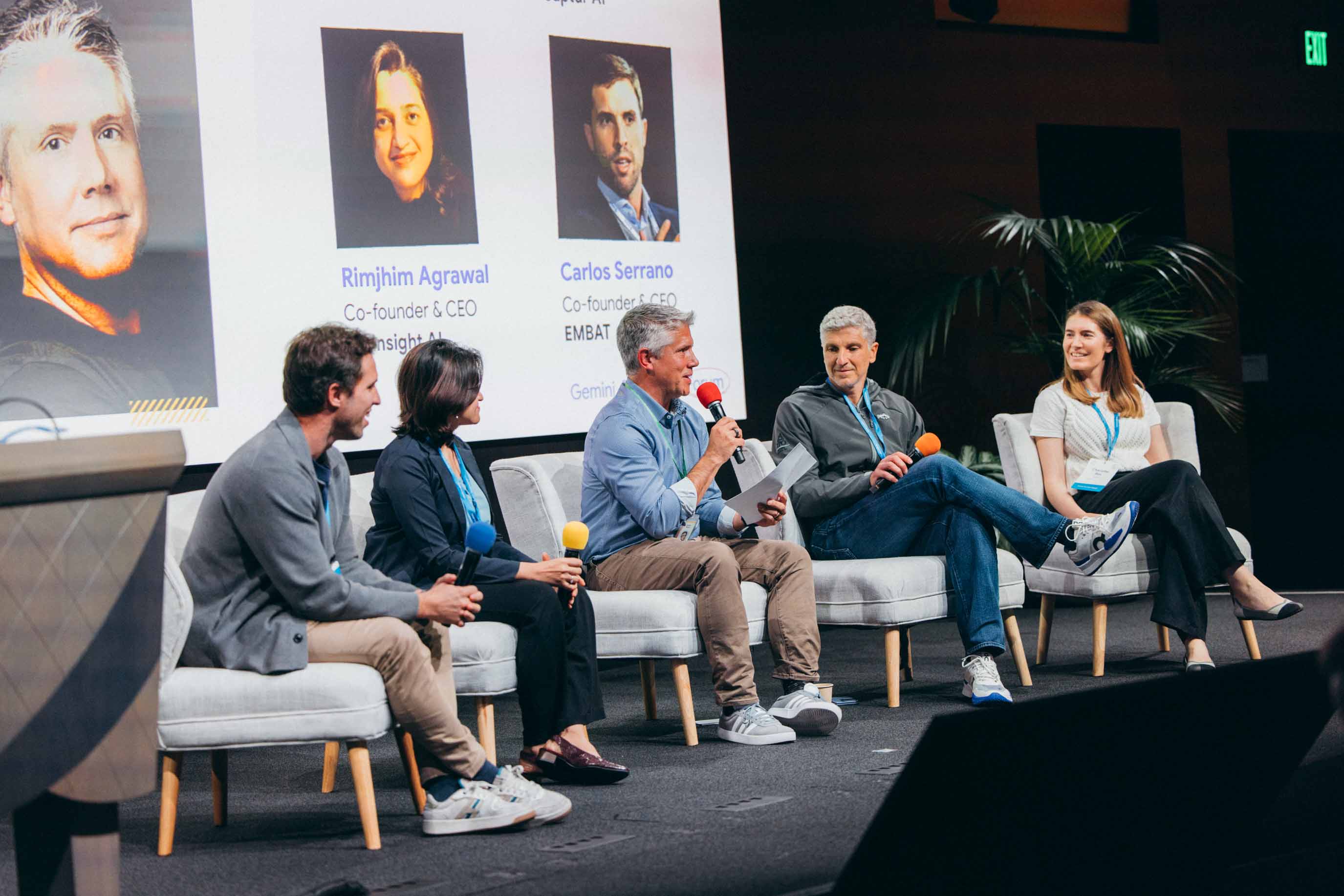 A panel discussion featuring speakers at a technology conference