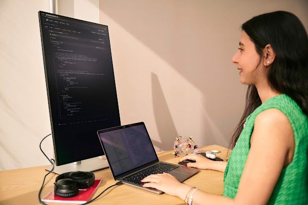 Developer working on an extended display monitor