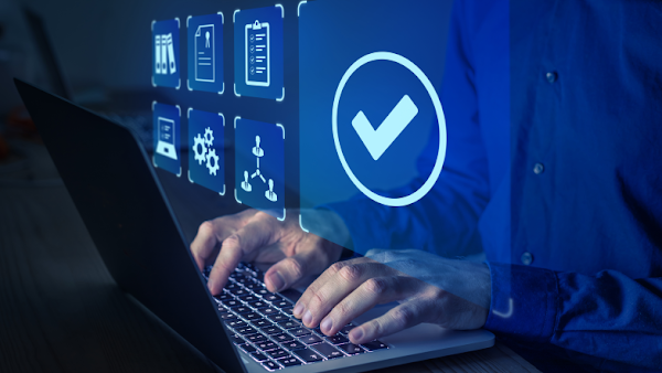 person reviewing security and risk checks on their laptop