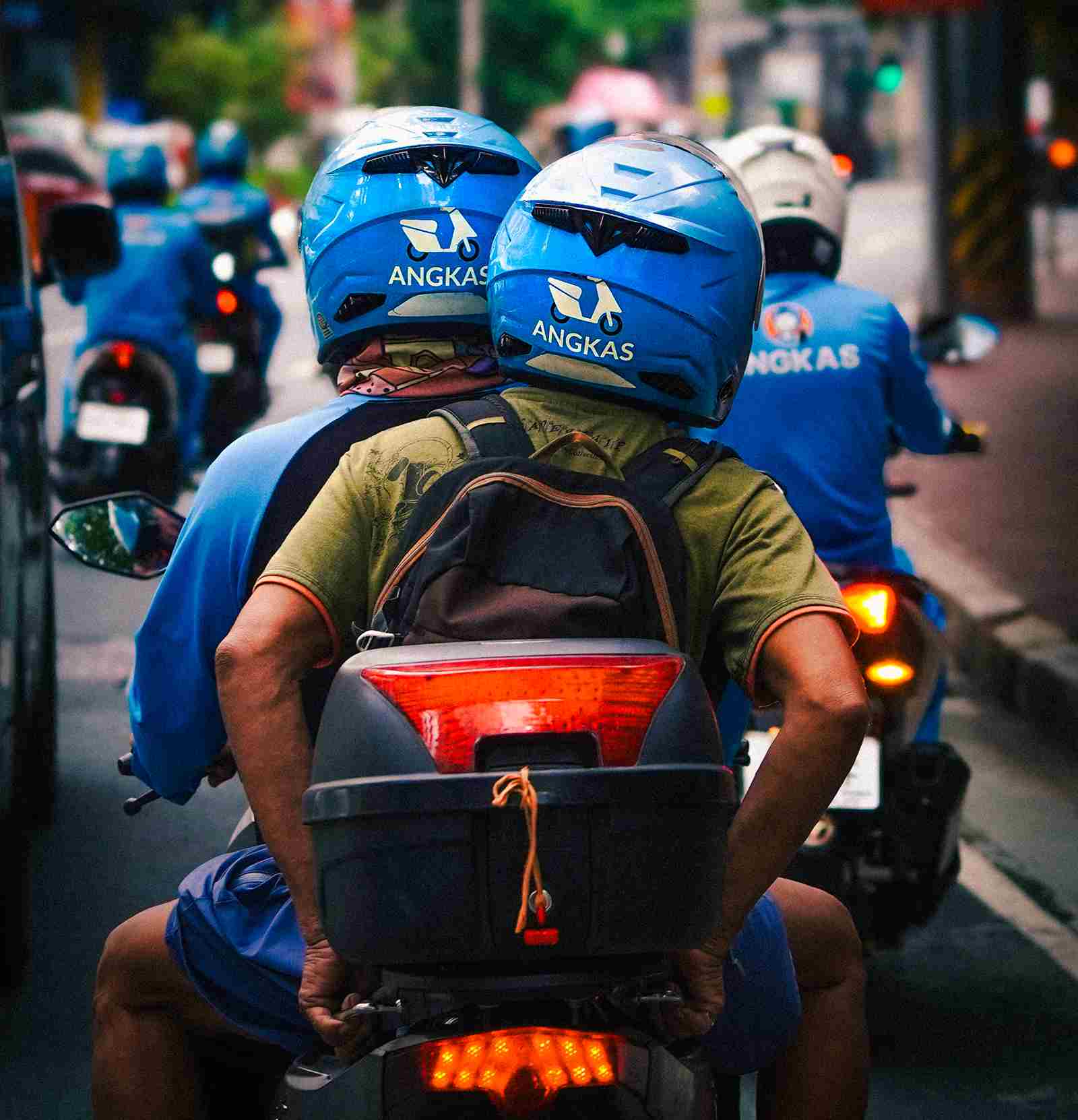 An Angkas driver taking his customer to his destination