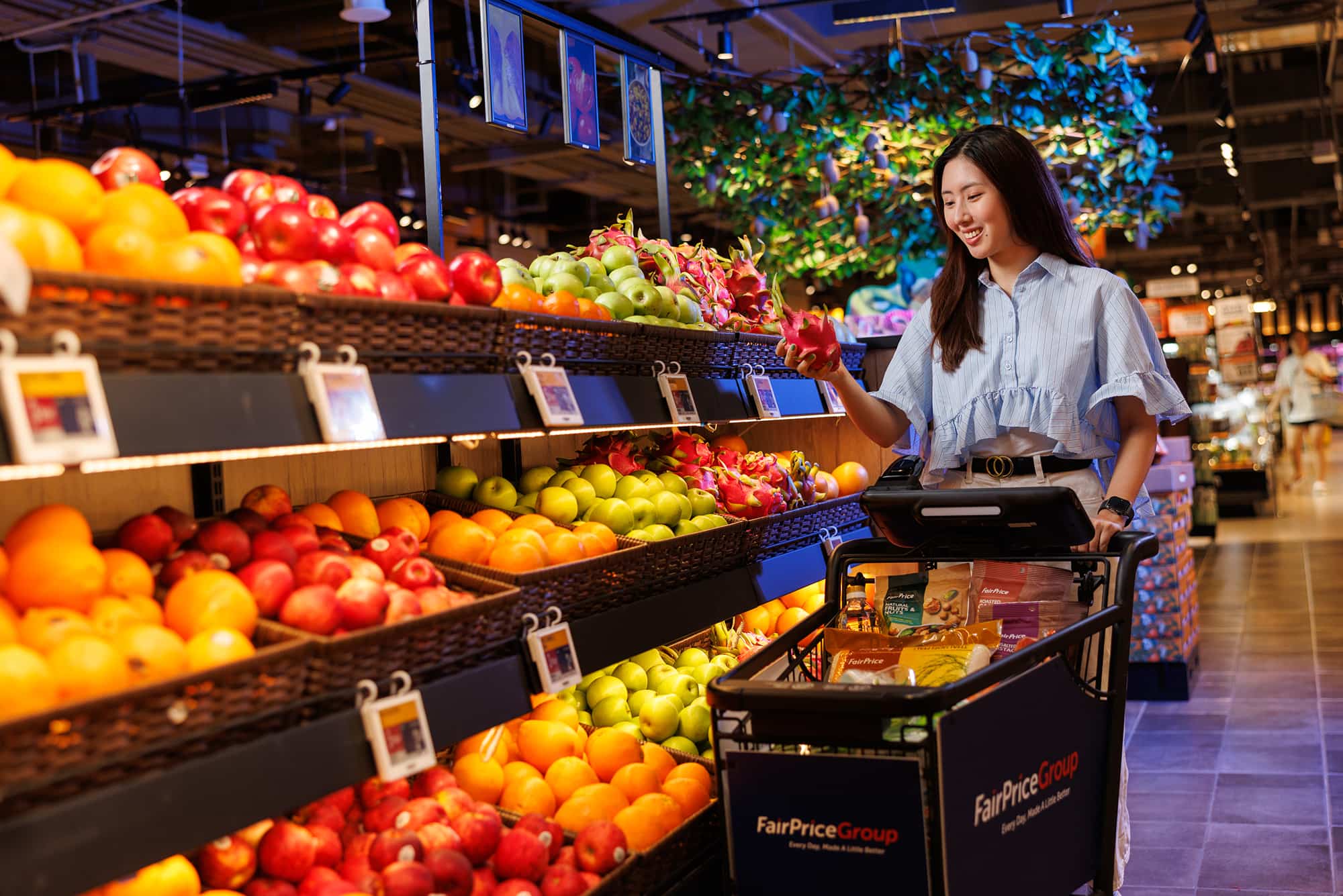 A woman inspecting fruits in the supermarket