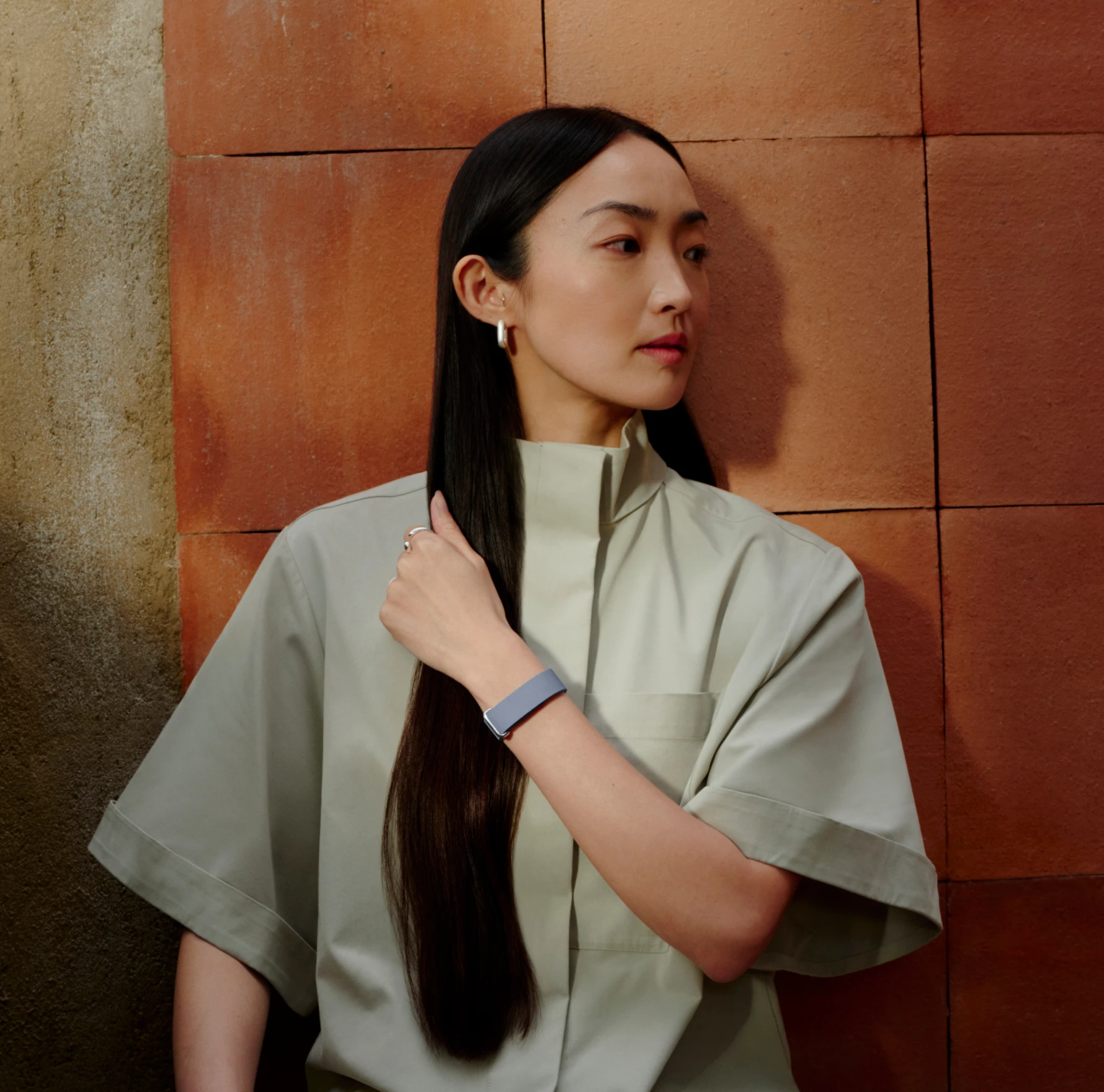 Image of woman wearing Google Fitbit Air