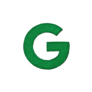 A green letter G made of fabric